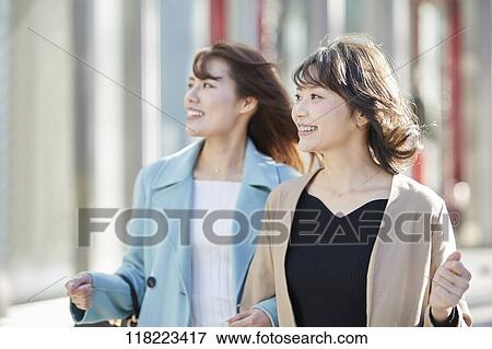 Stock Photo - Young Japanese women downtown Tokyo. Fotosearch