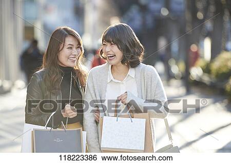 Stock Photograph - Young Japanese women downtown Tokyo. Fotosearch