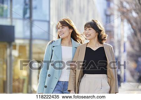 Stock Photography - Young Japanese women downtown Tokyo. Fotosearch