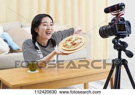 Young Japanese youtuber streaming at home View Large Photo Image Stock Image - Young Japanese youtuber streaming at home. Fotosearch