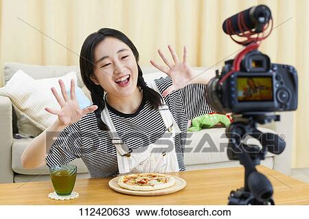 Young Japanese youtuber streaming at home View Large Photo Image Stock Image - Young Japanese youtuber streaming at home. Fotosearch