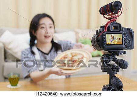 Young Japanese youtuber streaming at home View Large Photo Image Stock Image - Young Japanese youtuber streaming at home. Fotosearch