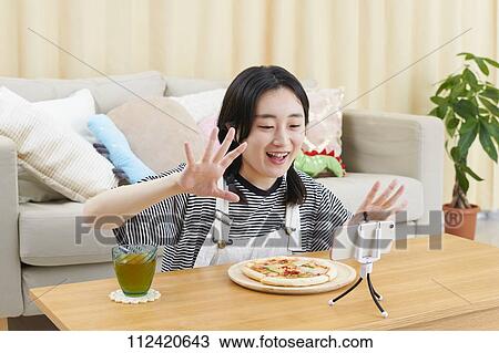Young Japanese youtuber streaming at home View Large Photo Image Stock Image - Young Japanese youtuber streaming at home. Fotosearch