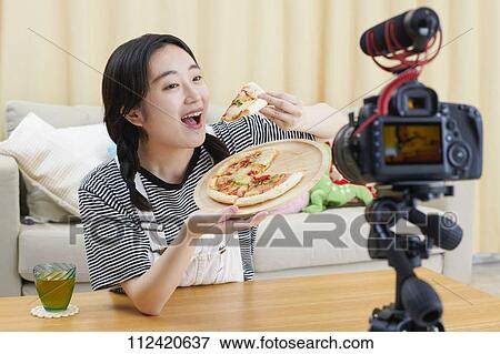 Young Japanese youtuber streaming at home View Large Photo Image Stock Photo - Young Japanese youtuber streaming at home. Fotosearch