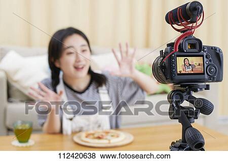 Young Japanese youtuber streaming at home View Large Photo Image Stock Photo - Young Japanese youtuber streaming at home. Fotosearch
