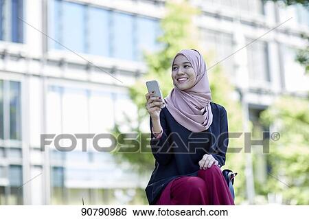 Stock Photograph - Young South-east Asian businesswoman. Fotosearch