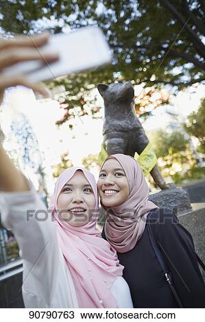 Young South-east Asian women enjoying sightseeing in Tokyo View Large Photo Image Stock Image - Young South-east Asian women enjoying sightseeing in Tokyo. Fotosearch