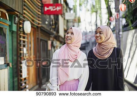 Young South-east Asian women enjoying sightseeing in Tokyo View Large Photo Image Stock Image - Young South-east Asian women enjoying sightseeing in Tokyo. Fotosearch