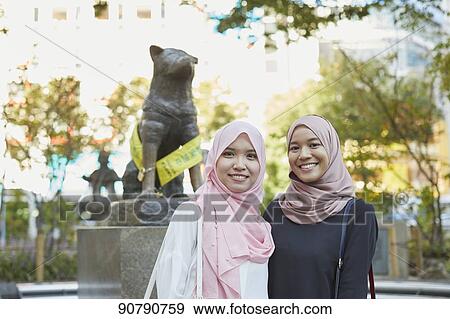 Young South-east Asian women enjoying sightseeing in Tokyo View Large Photo Image Stock Photo - Young South-east Asian women enjoying sightseeing in Tokyo. Fotosearch