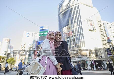 Young South-east Asian women enjoying sightseeing in Tokyo View Large Photo Image Stock Photo - Young South-east Asian women enjoying sightseeing in Tokyo. Fotosearch