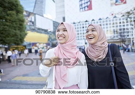Young South-east Asian women enjoying sightseeing in Tokyo View Large Photo Image Stock Photo - Young South-east Asian women enjoying sightseeing in Tokyo. Fotosearch