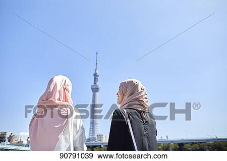 Young South-east Asian women enjoying sightseeing in Tokyo View Large Photo Image Stock Photo - Young South-east Asian women enjoying sightseeing in Tokyo. Fotosearch