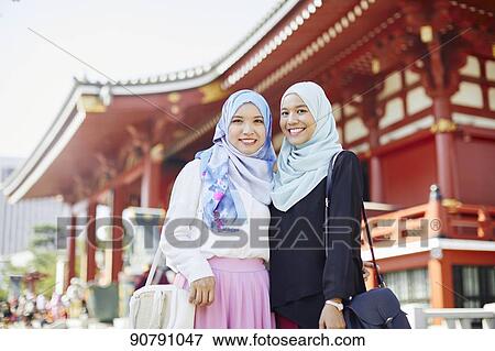 Young South-east Asian women enjoying sightseeing in Tokyo View Large Photo Image Stock Photo - Young South-east Asian women enjoying sightseeing in Tokyo. Fotosearch