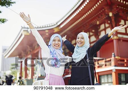 Young South-east Asian women enjoying sightseeing in Tokyo View Large Photo Image Stock Photo - Young South-east Asian women enjoying sightseeing in Tokyo. Fotosearch