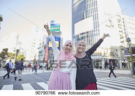 Young South-east Asian women enjoying sightseeing in Tokyo View Large Photo Image Stock Photograph - Young South-east Asian women enjoying sightseeing in Tokyo. Fotosearch