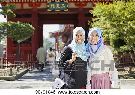 Young South-east Asian women enjoying sightseeing in Tokyo View Large Photo Image Stock Photograph - Young South-east Asian women enjoying sightseeing in Tokyo. Fotosearch