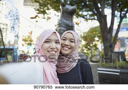 Young South-east Asian women enjoying sightseeing in Tokyo View Large Photo Image Stock Photography - Young South-east Asian women enjoying sightseeing in Tokyo. Fotosearch
