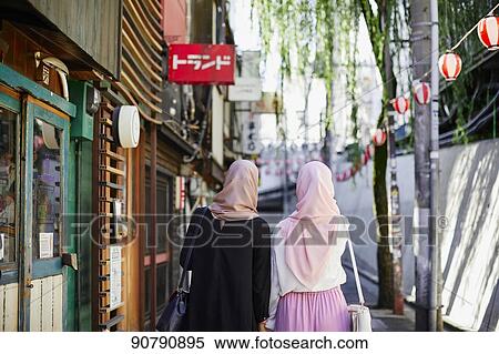 Young South-east Asian women enjoying sightseeing in Tokyo View Large Photo Image Stock Photography - Young South-east Asian women enjoying sightseeing in Tokyo. Fotosearch