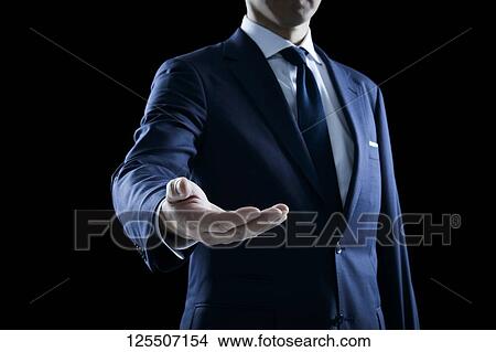 Businessman on black background View Large Photo Image Picture - Businessman on black background. Fotosearch
