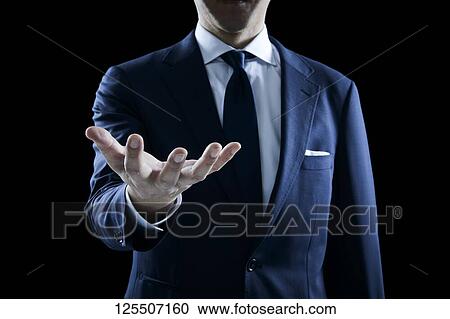 Businessman on black background View Large Photo Image Stock Image - Businessman on black background. Fotosearch
