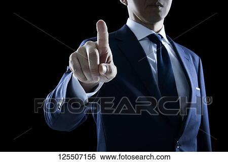 Businessman on black background View Large Photo Image Stock Photograph - Businessman on black background. Fotosearch