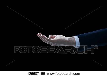 Stock Photograph - Businessman on black background. Fotosearch
