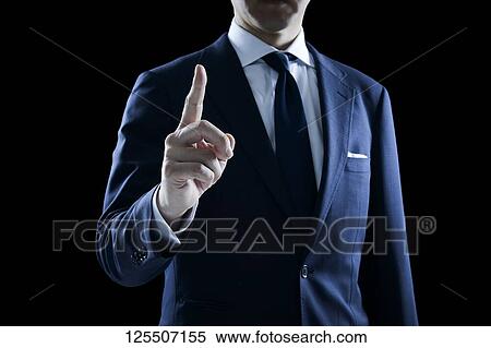 Stock Photography - Businessman on black background. Fotosearch