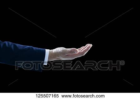 Stock Photography - Businessman on black background. Fotosearch