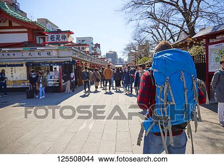 Picture - Caucasian man visiting Tokyo, Japan. Fotosearch
