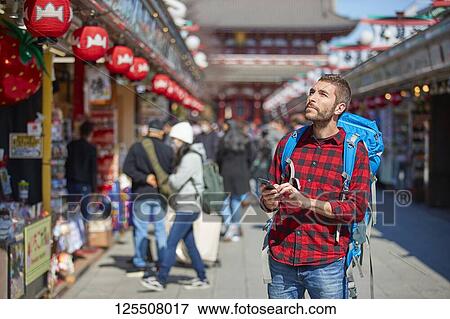 Caucasian man visiting Tokyo, Japan View Large Photo Image Stock Photo - Caucasian man visiting Tokyo, Japan. Fotosearch