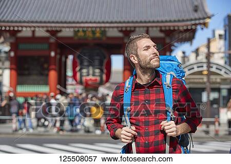 Stock Photo - Caucasian man visiting Tokyo, Japan. Fotosearch