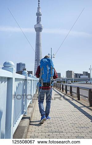 Stock Photo - Caucasian man visiting Tokyo, Japan. Fotosearch