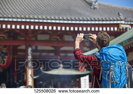 Caucasian man visiting Tokyo, Japan View Large Photo Image Stock Photograph - Caucasian man visiting Tokyo, Japan. Fotosearch