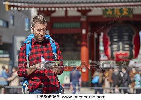 Caucasian man visiting Tokyo, Japan View Large Photo Image Stock Photograph - Caucasian man visiting Tokyo, Japan. Fotosearch