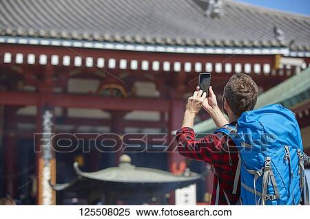 Stock Photography - Caucasian man visiting Tokyo, Japan. Fotosearch