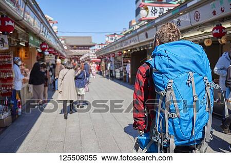 Stock Photography - Caucasian man visiting Tokyo, Japan. Fotosearch