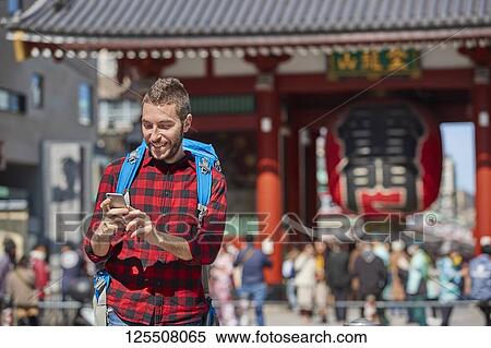 Caucasian man visiting Tokyo, Japan View Large Photo Image Stock Photography - Caucasian man visiting Tokyo, Japan. Fotosearch