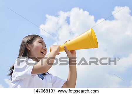 Stock Photo - Cheering Japanese junior high schoolgirl. Fotosearch