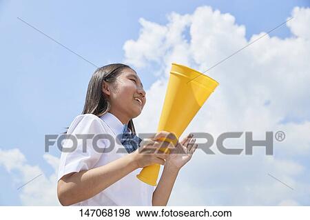 Stock Photo - Cheering Japanese junior high schoolgirl. Fotosearch
