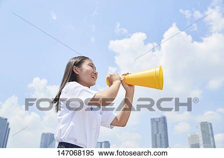 Stock Photography - Cheering Japanese junior high schoolgirl. Fotosearch