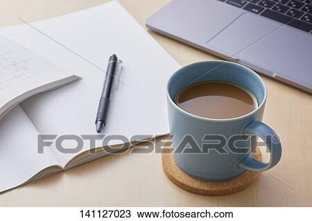 Stock Image - Cup Of Coffee On The Desk. Fotosearch