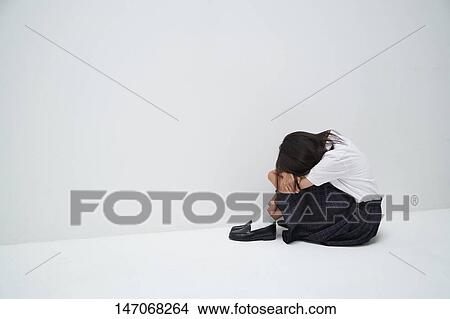 Picture - Depressed Japanese junior high schoolgirl. Fotosearch