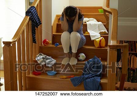 Stock Photo - Depressed Japanese woman at home. Fotosearch