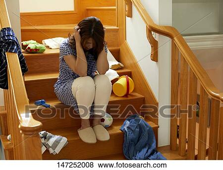 Depressed Japanese woman at home View Large Photo Image Stock Photo - Depressed Japanese woman at home. Fotosearch