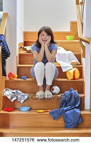 Stock Photograph - Depressed Japanese woman at home. Fotosearch