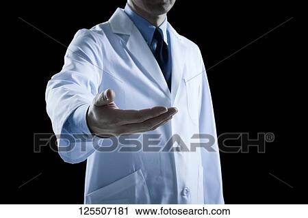 Stock Image - Doctor on black background. Fotosearch