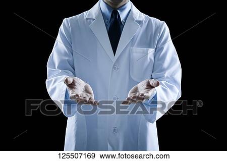 Stock Photo - Doctor on black background. Fotosearch