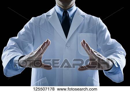 Stock Photo - Doctor on black background. Fotosearch