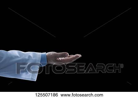 Stock Photograph - Doctor on black background. Fotosearch