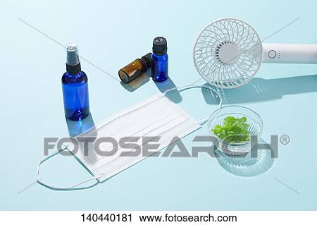 Stock Image - Face Mask And Handy Fan. Fotosearch